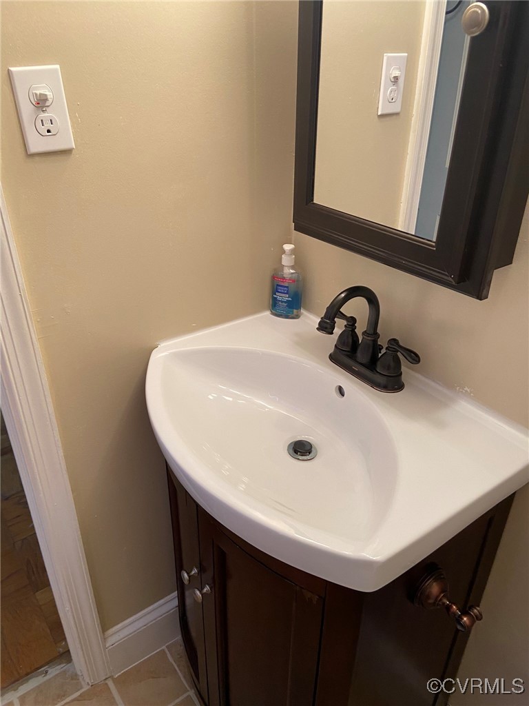 9 Millstone Road, Unit 9 Henrico, VA 23228 - Photo 18 of 27 a bathroom with a sink and a mirror