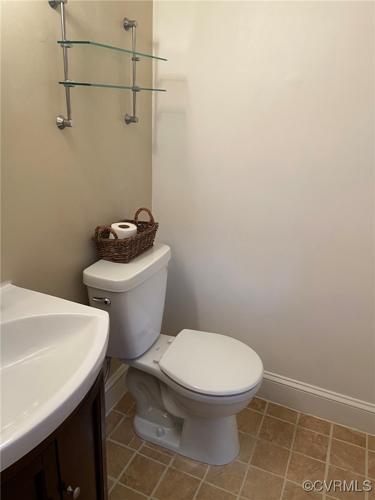 9 Millstone Road, Unit 9 Henrico, VA 23228 - Photo 19 of 27 a white toilet sitting next to a bathroom sink