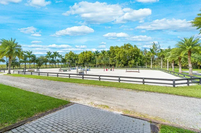 a view of a park with swings and slides