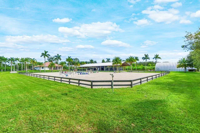 an aerial view of a house with a garden and a yard