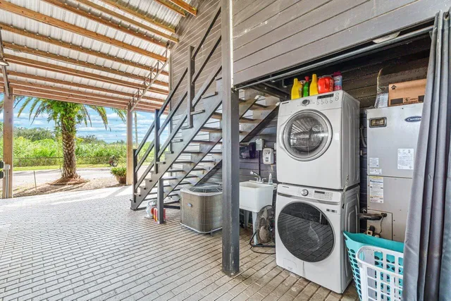 a view of a hallway with washer and dryer