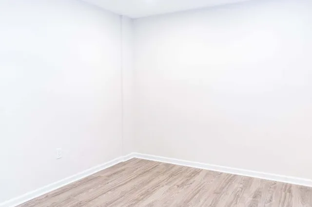 a view of a small space with wooden floor