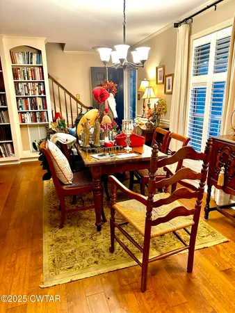 a view of a dining room with furniture and a rug