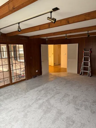 a view of an empty room with a window