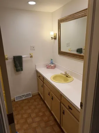 a bathroom with a sink and a mirror