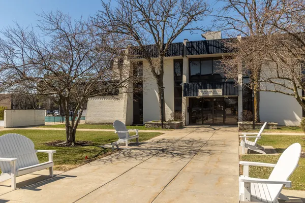a view of a patio with table and chairs and potted plants