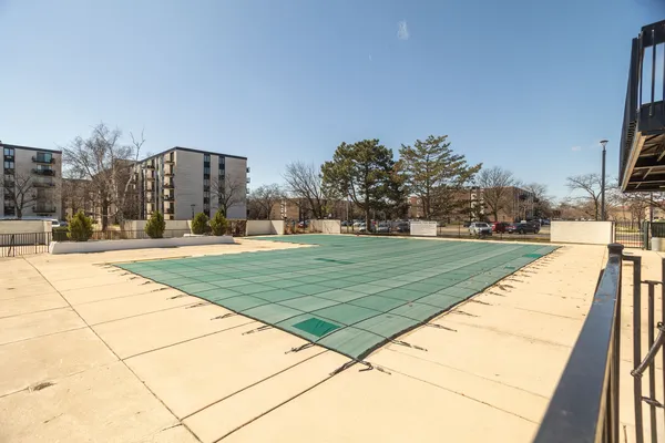 a view of swimming pool with a yard