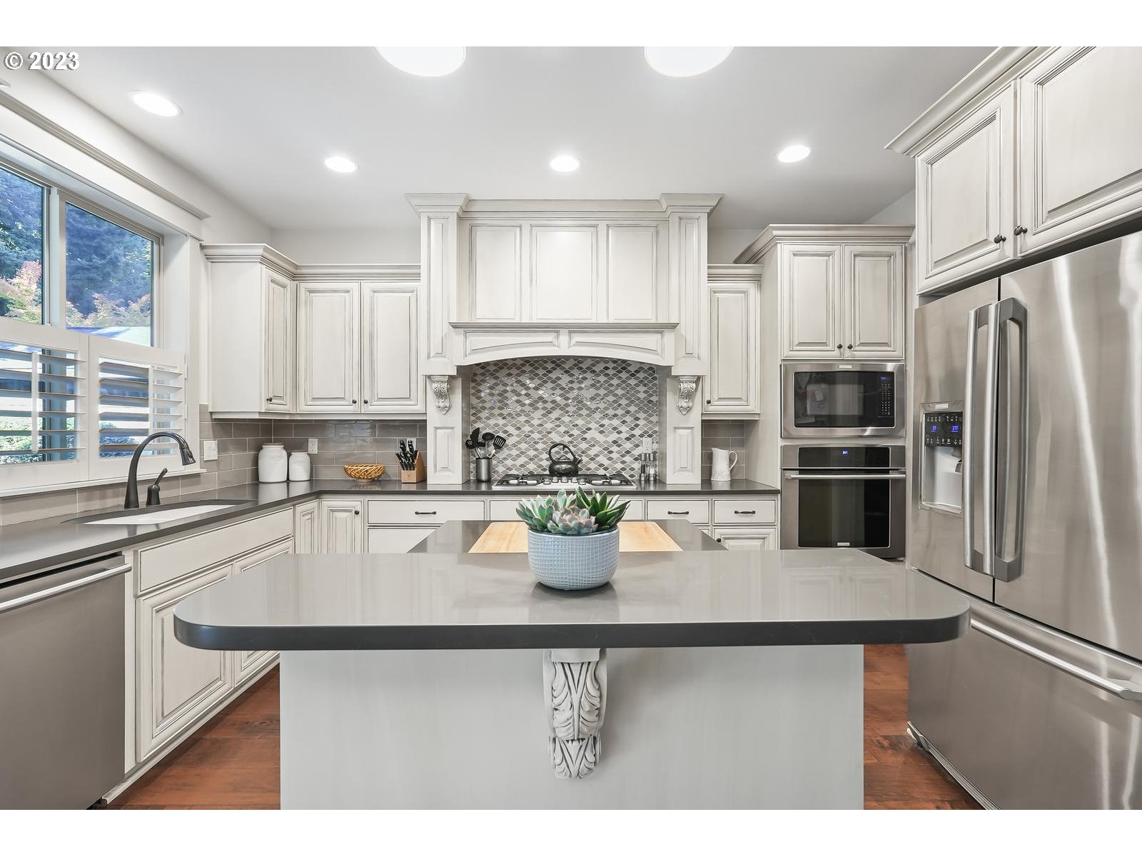 4845 Upper Drive Lake Oswego, OR 97035 - Photo 9 of 35 a kitchen with a refrigerator and a sink