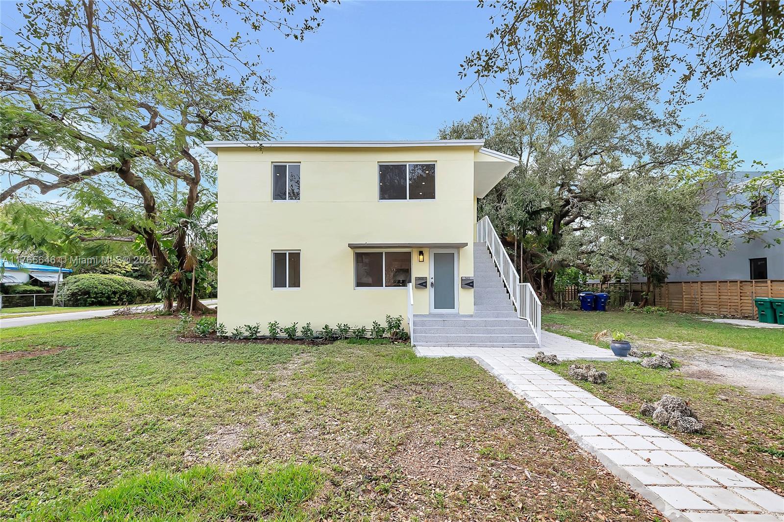 3402 Day Avenue Miami, FL 33133 - Photo 13 of 21 a view of a house with a yard
