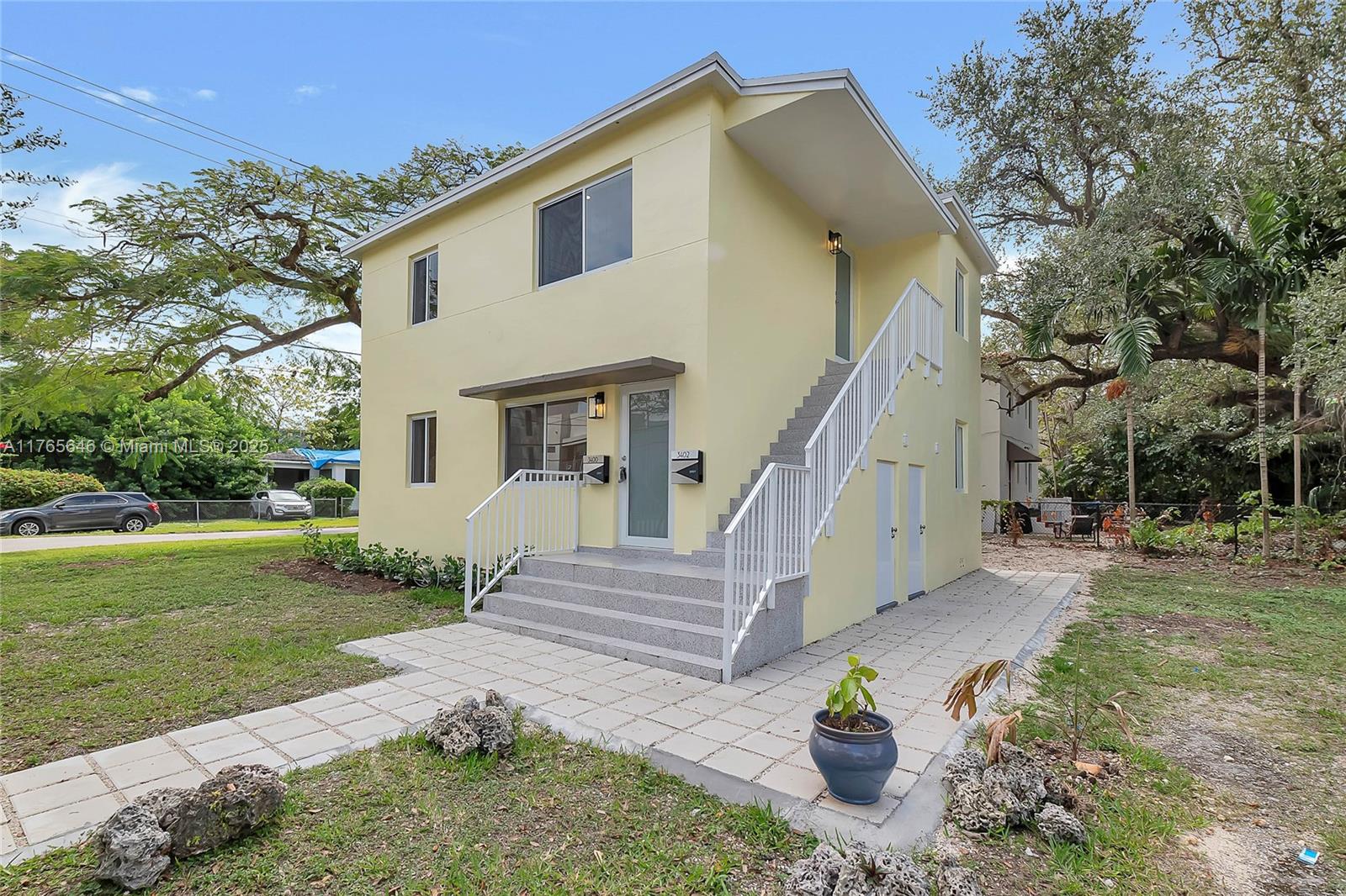 3402 Day Avenue Miami, FL 33133 - Photo 15 of 21 a view of a house with a yard