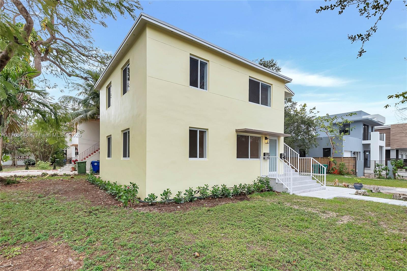 3402 Day Avenue Miami, FL 33133 - Photo 17 of 21 a front view of a house with a yard