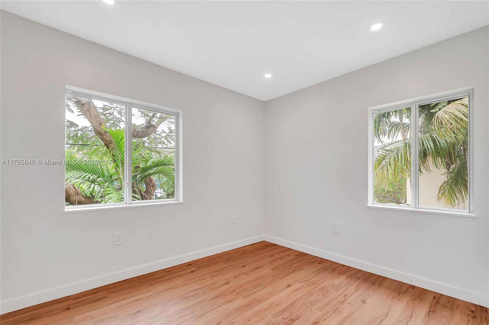 3402 Day Avenue Miami, FL 33133 - Photo 9 of 21 an empty room with wooden floor and windows