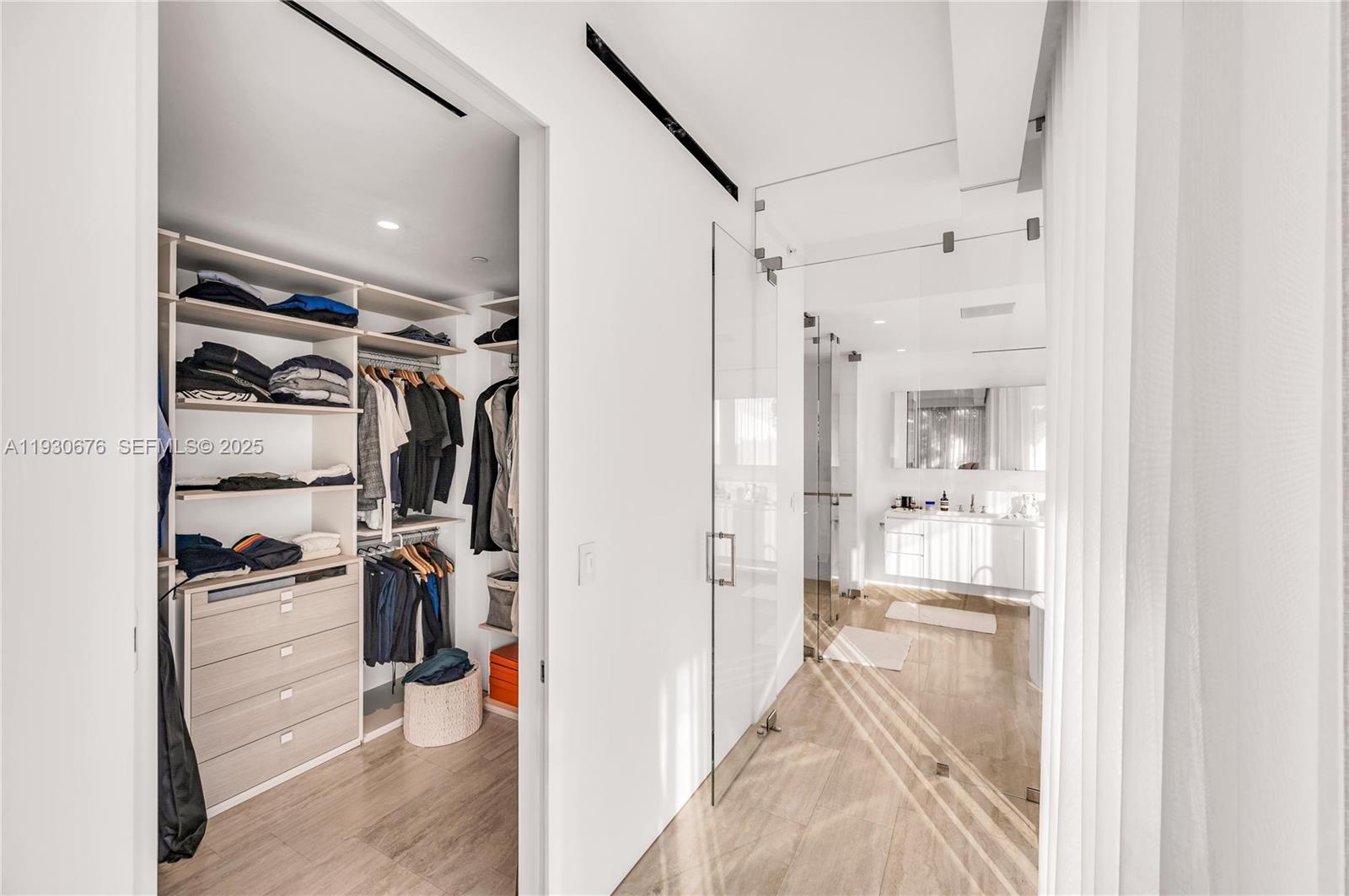 9001 Collins Avenue, Unit S402 Surfside, FL 33154 - Photo 16 of 19 a view of a walk in closet and kitchen