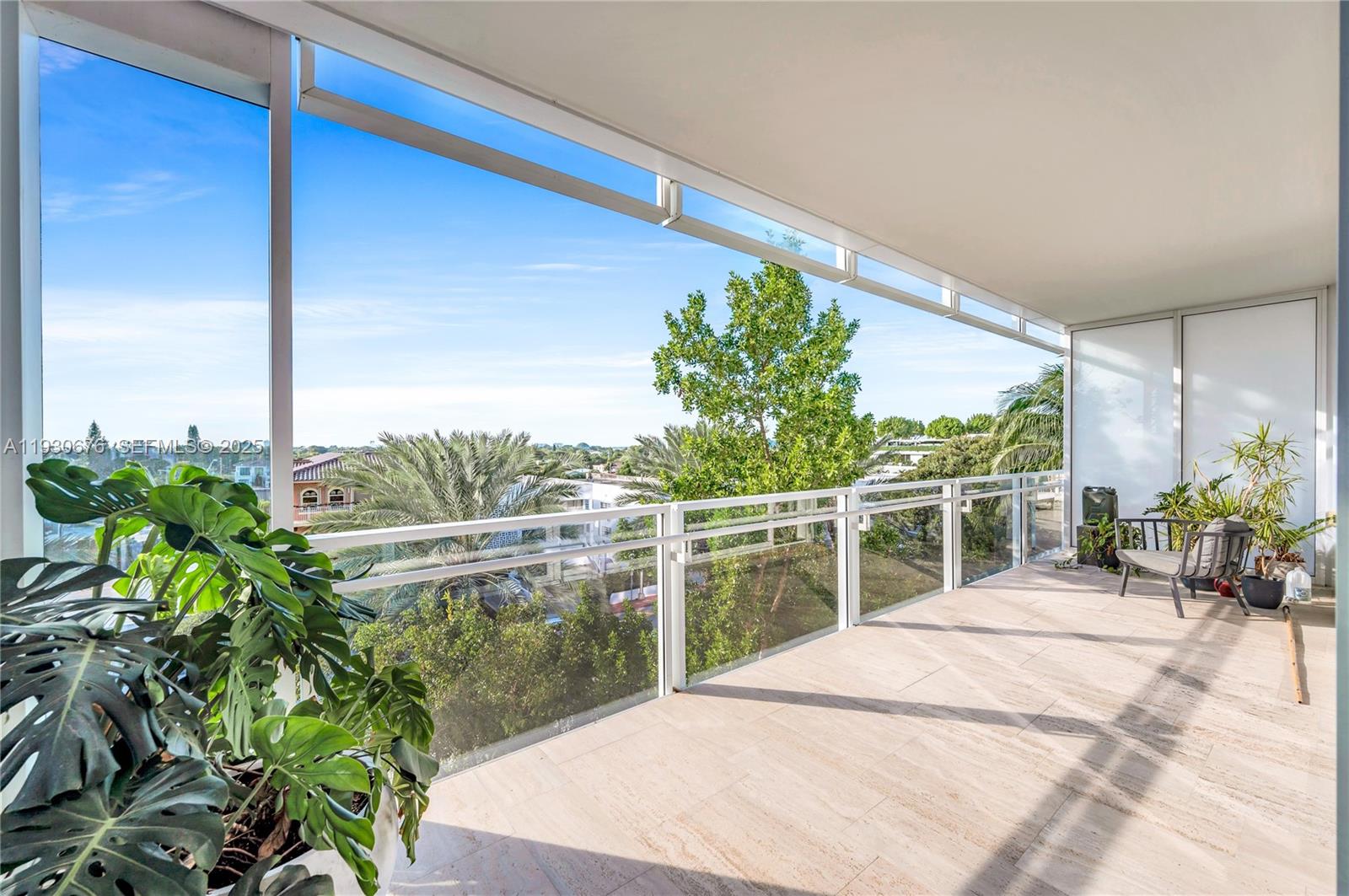9001 Collins Avenue, Unit S402 Surfside, FL 33154 - Photo 7 of 19 a view of a chairs and table in patio