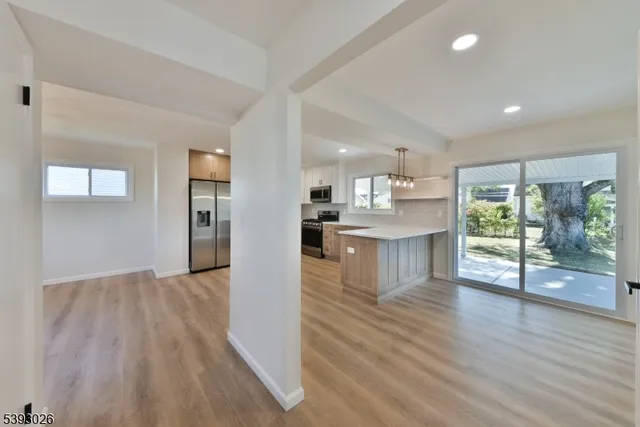 a view of kitchen with wooden floor