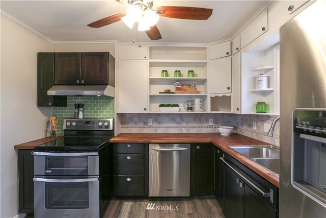a kitchen with a stove and a sink