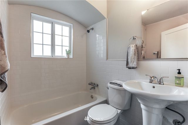 a bathroom with a sink toilet and bathtub