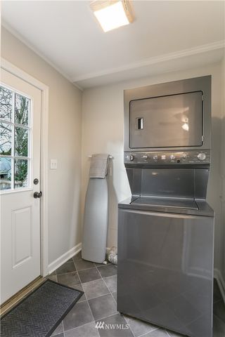 a view of a kitchen with washer and dryer