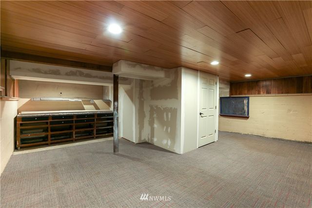 a view of an empty room with a fireplace