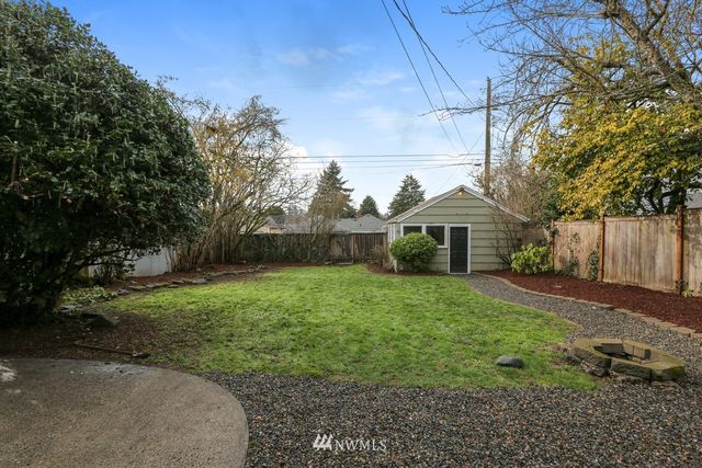 a view of a house with yard and a garden