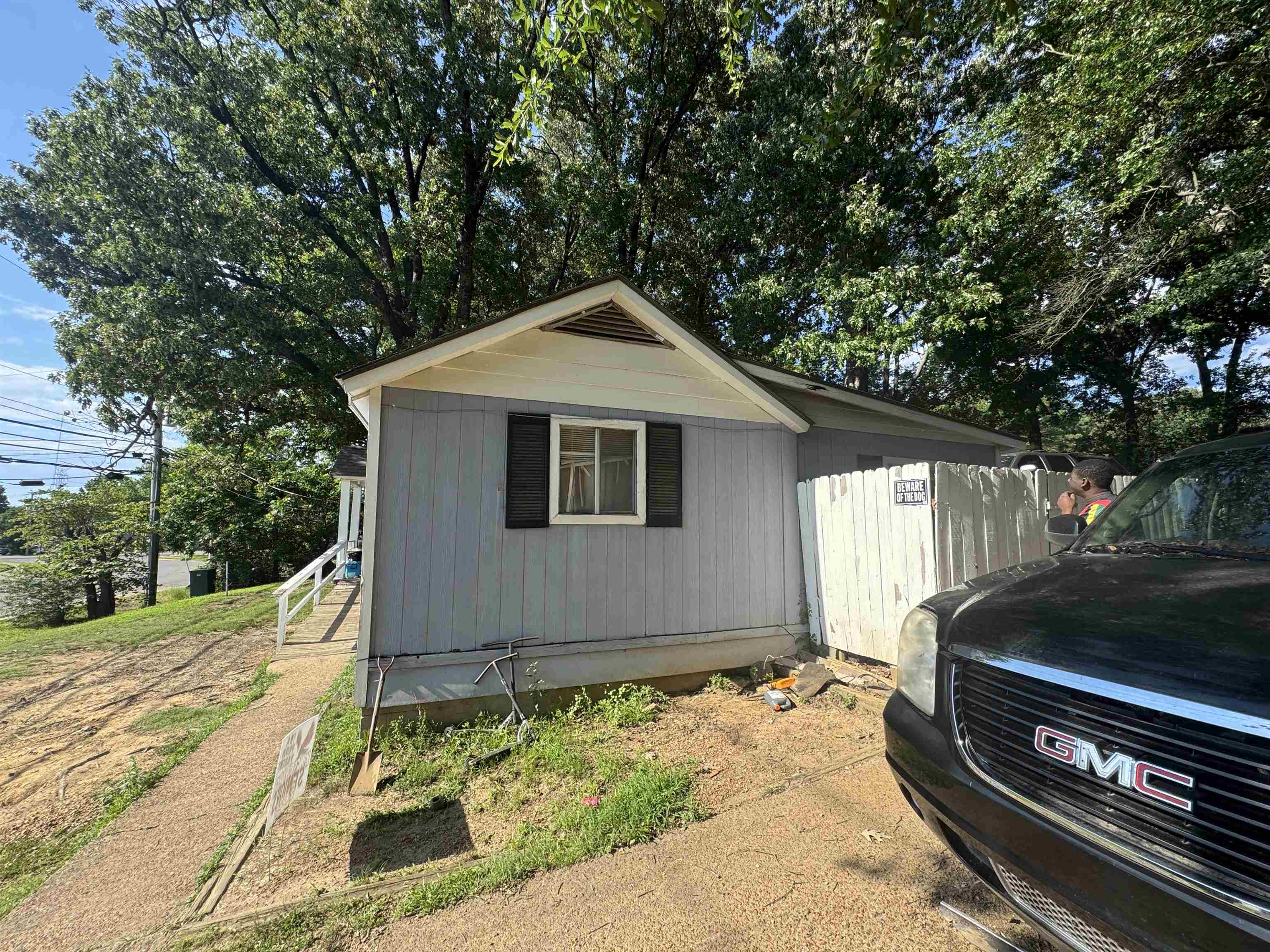 2166 Thomas Road Memphis, TN 38134 - Photo 3 of 10 Light blue siding exterior with white trim and a gabled dormer