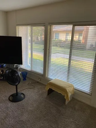 a view of a house with a small yard