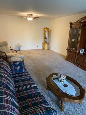 a view of a patio with table and chairs