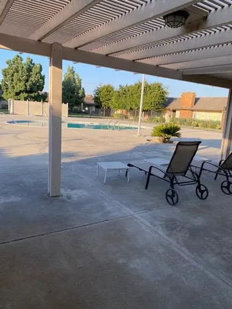 a view of a swimming pool with a yard