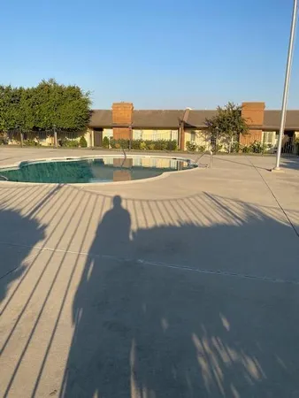 a kitchen with stainless steel appliances a refrigerator and a stove top oven