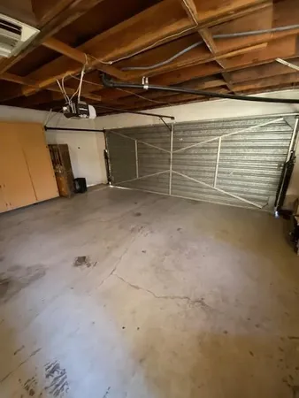 a room with furniture and a large window