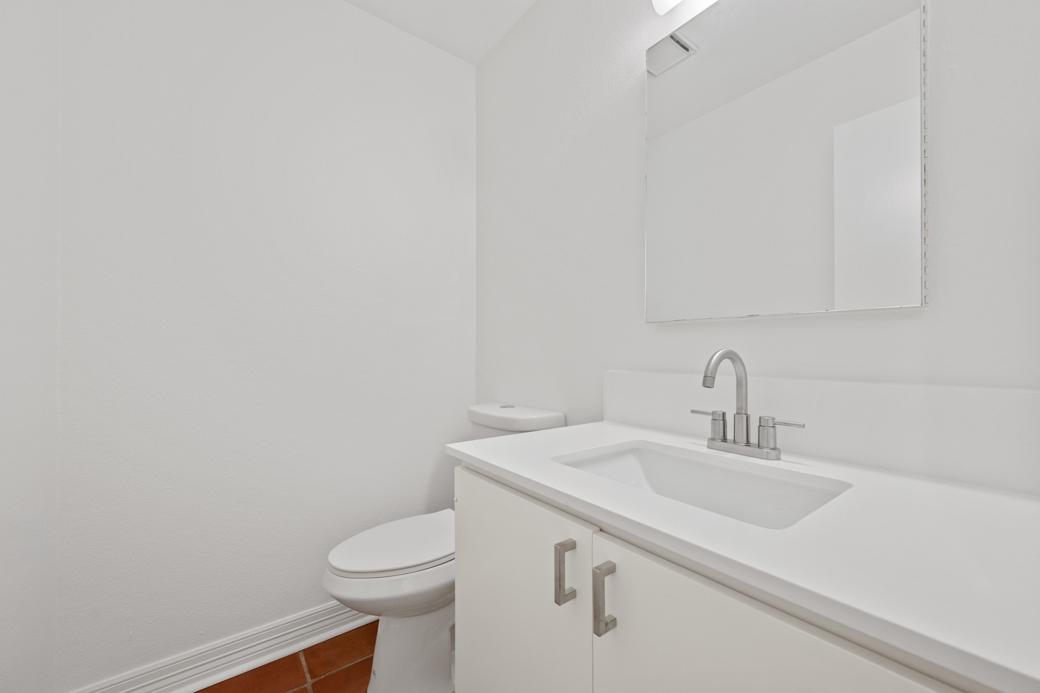 409 East 38th Street, Unit 101 Austin, TX 78705 - Photo 20 of 27 This half bathroom is located just off of the main living room. Features new counters, sink, faucets and light fixtures.