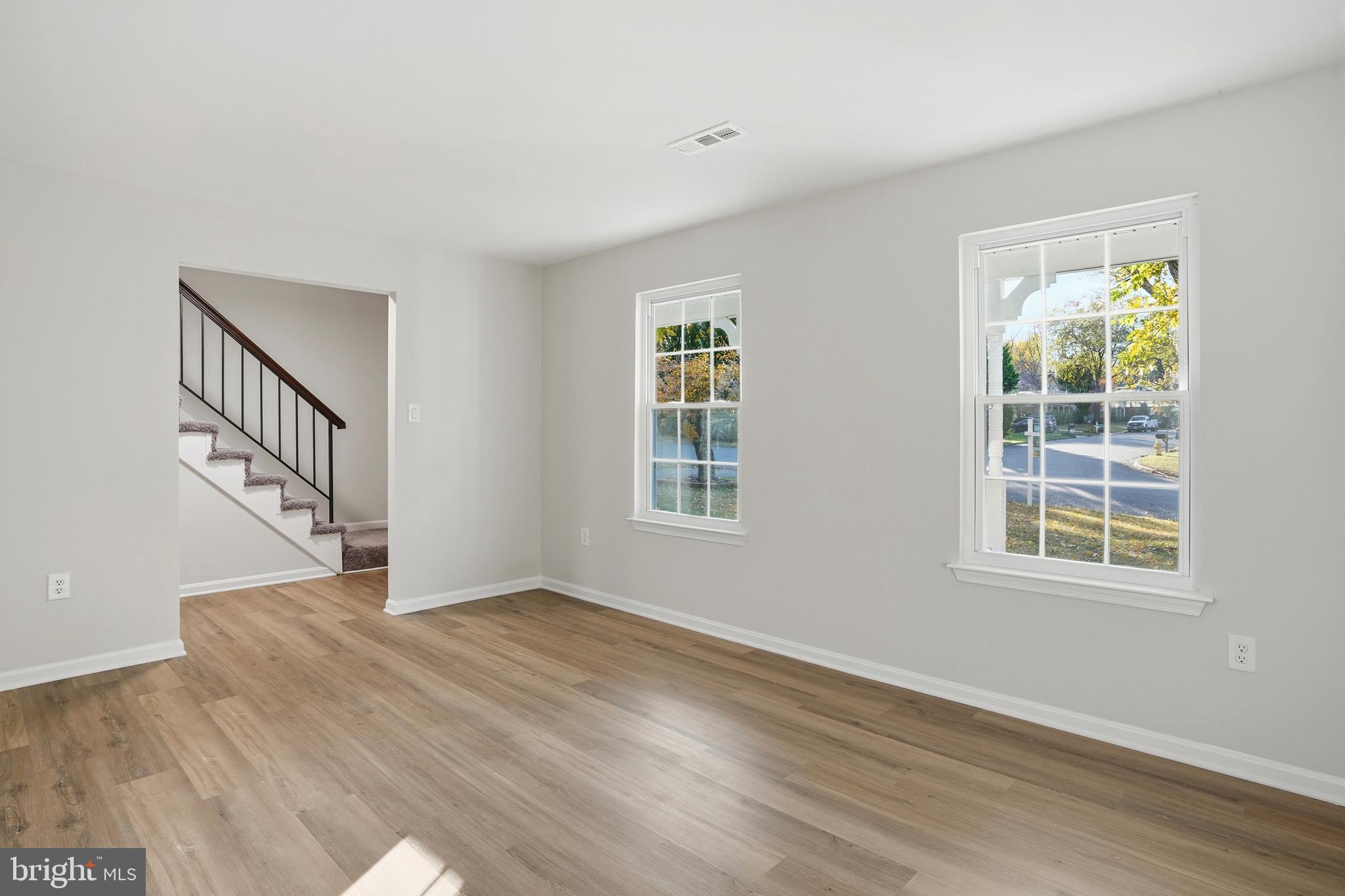 13357 Pelican Road Woodbridge, VA 22193 - Photo 11 of 48 a view of an empty room with wooden floor and a window