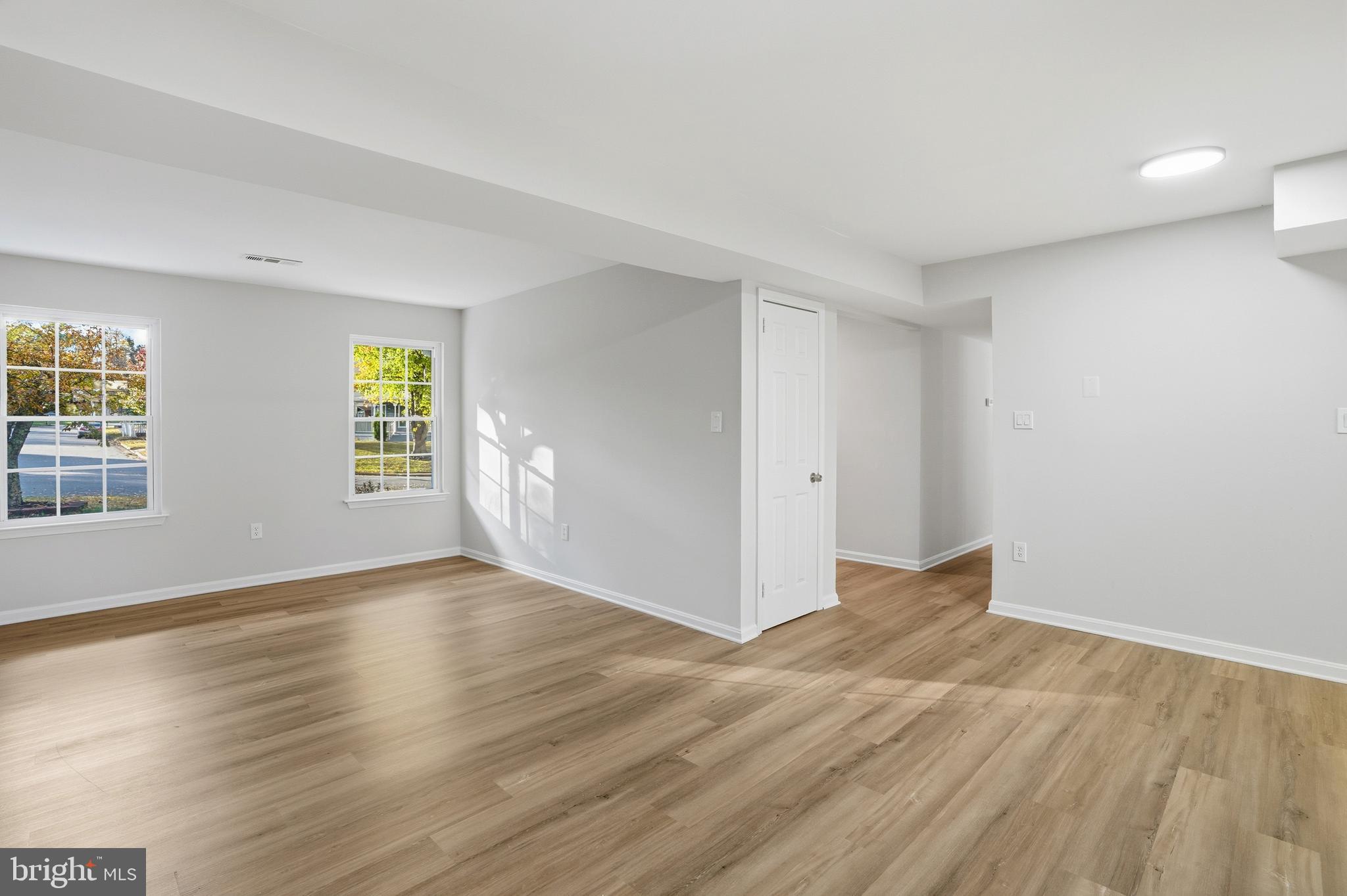 13357 Pelican Road Woodbridge, VA 22193 - Photo 24 of 48 an empty room with wooden floor and windows