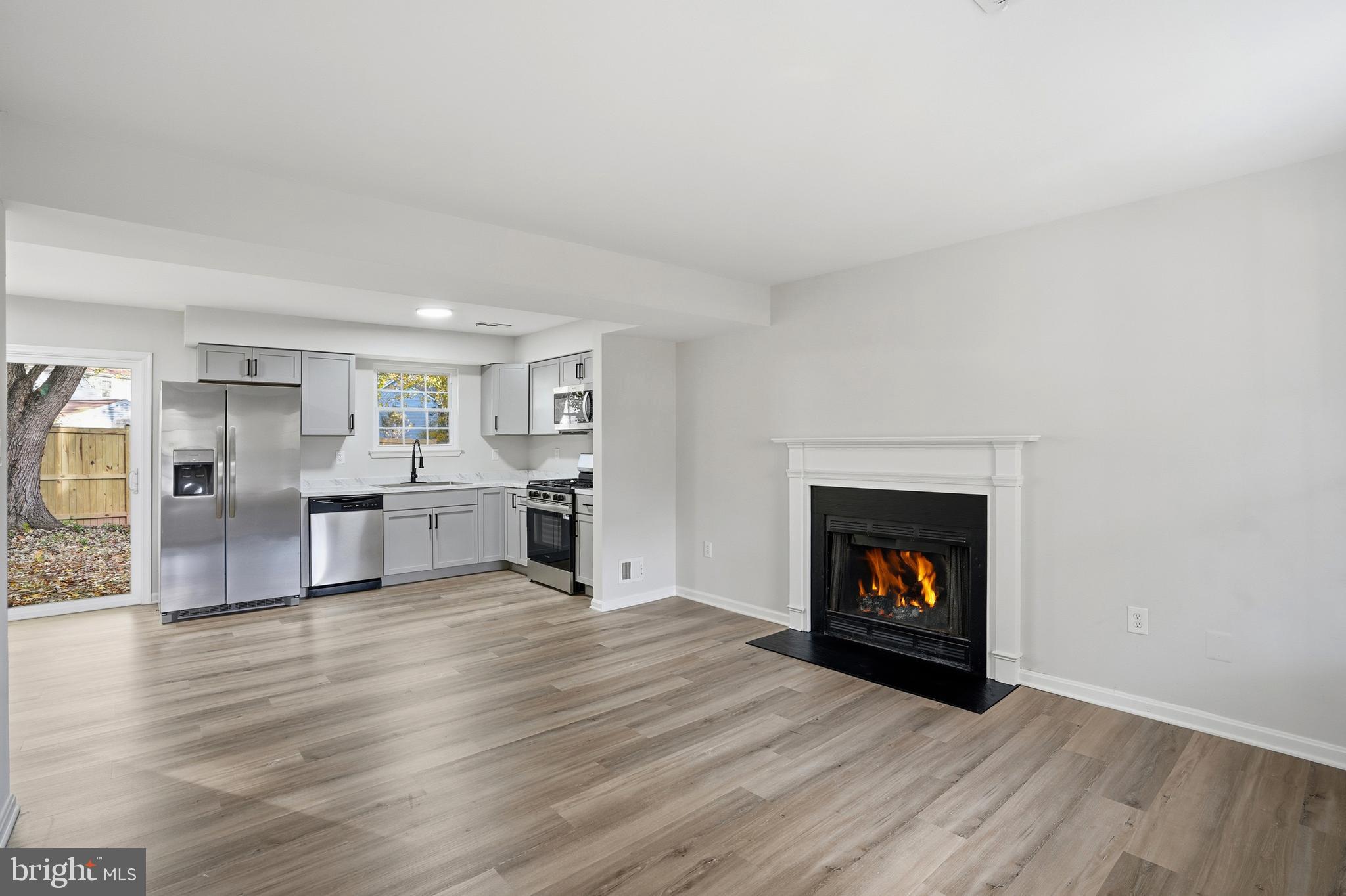 13357 Pelican Road Woodbridge, VA 22193 - Photo 25 of 48 a view of a livingroom with a fireplace and wooden floor