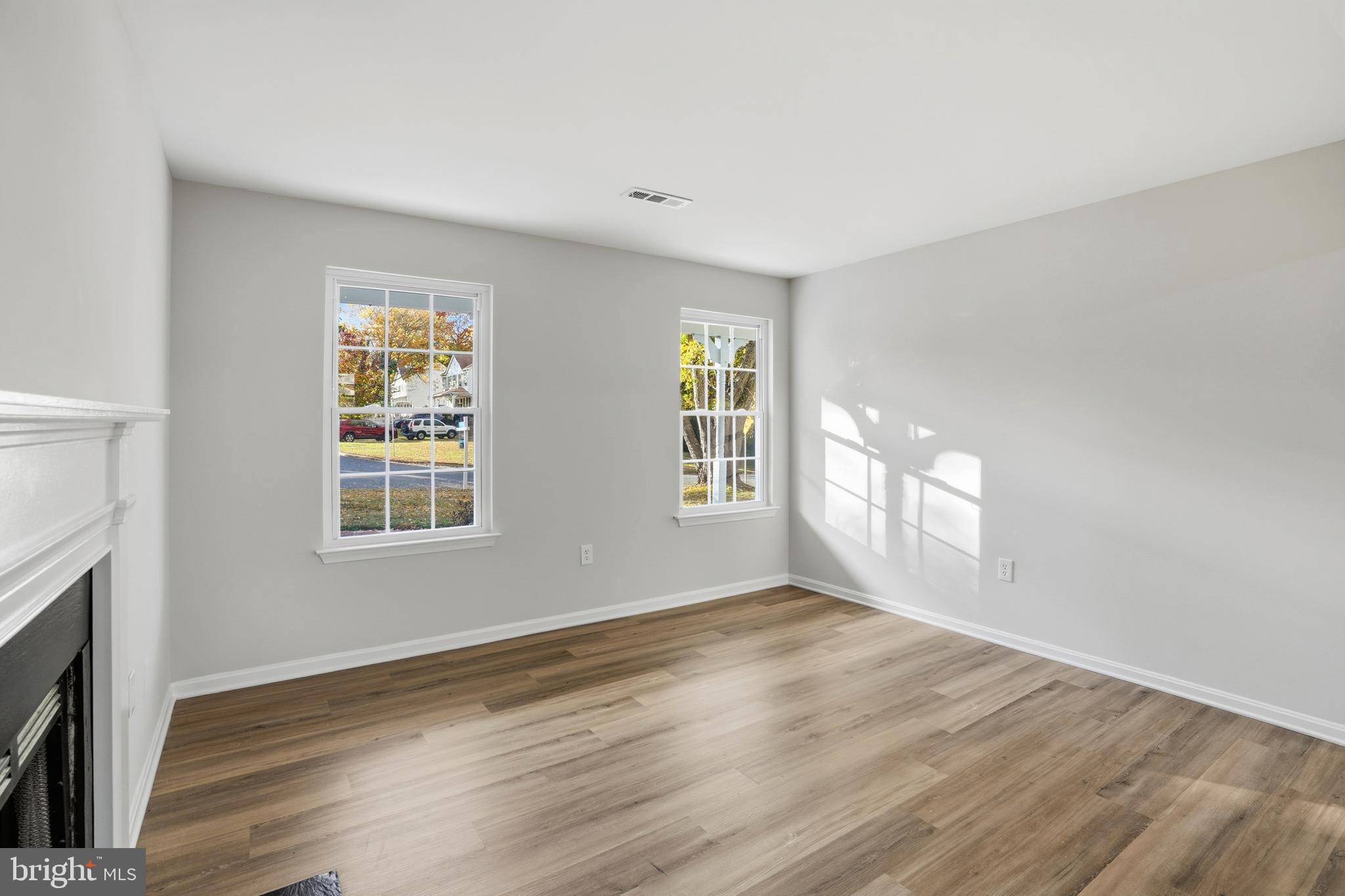 13357 Pelican Road Woodbridge, VA 22193 - Photo 26 of 48 a view of an empty room with wooden floor and a window