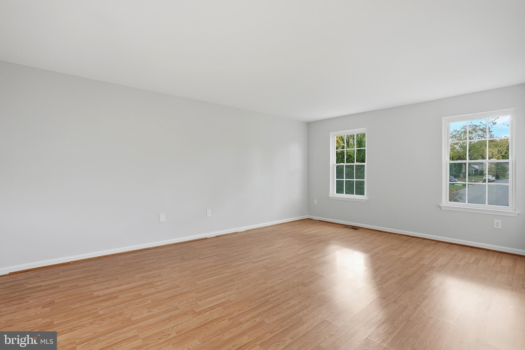 13357 Pelican Road Woodbridge, VA 22193 - Photo 30 of 48 a view of an empty room with wooden floor and windows