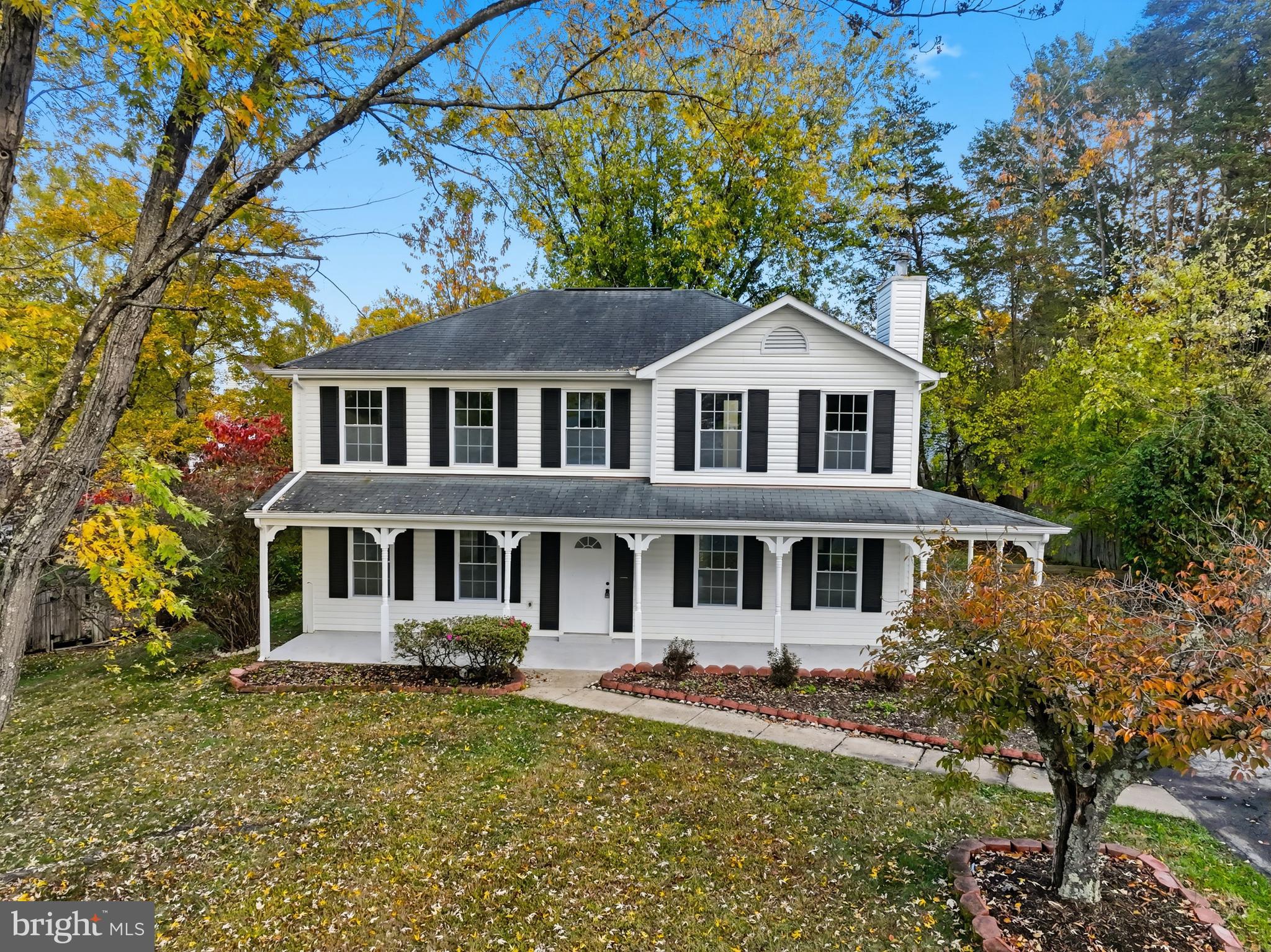 13357 Pelican Road Woodbridge, VA 22193 - Photo 3 of 48 a front view of a house with a yard