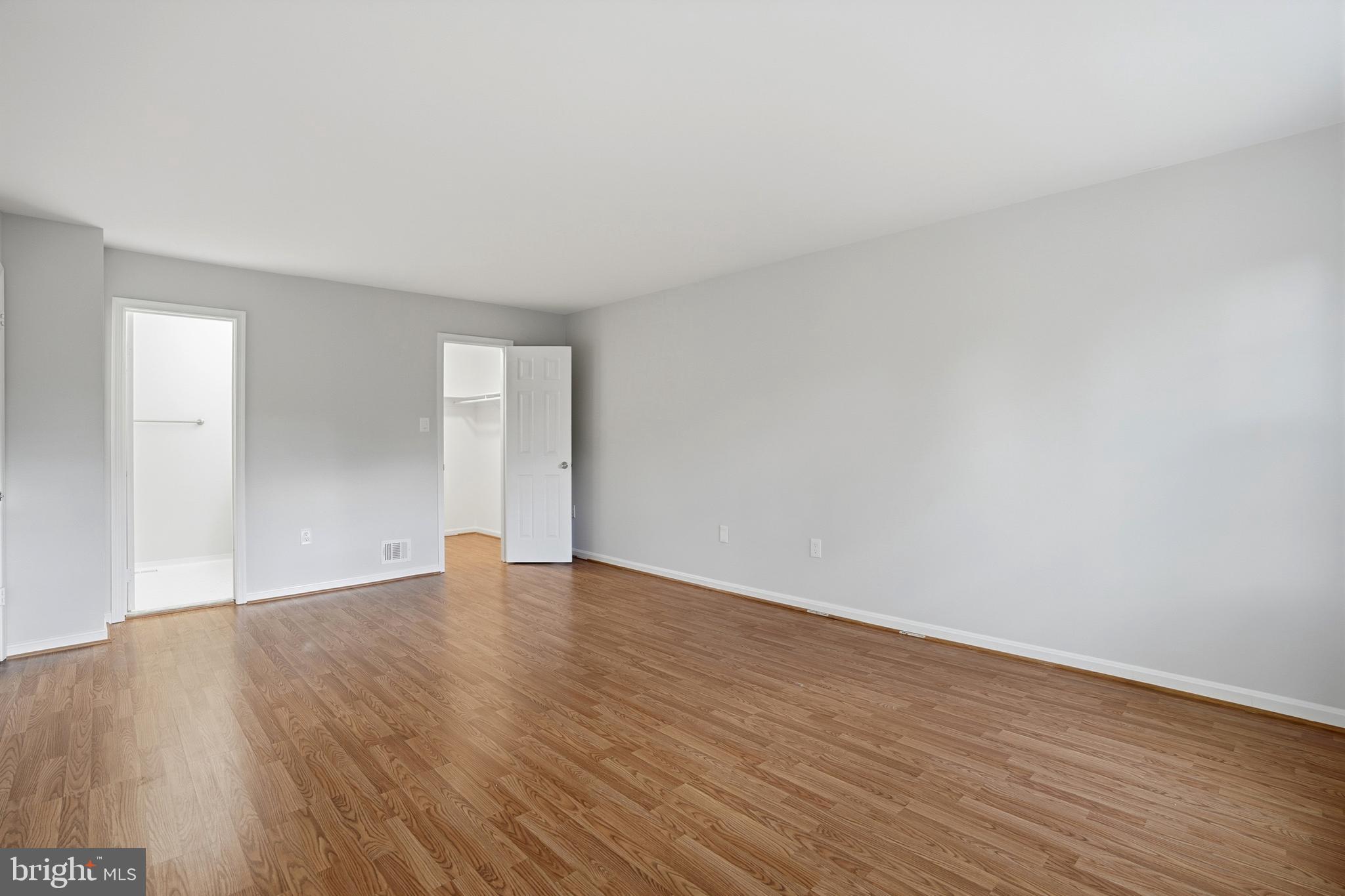13357 Pelican Road Woodbridge, VA 22193 - Photo 31 of 48 a view of an empty room with wooden floor and a window