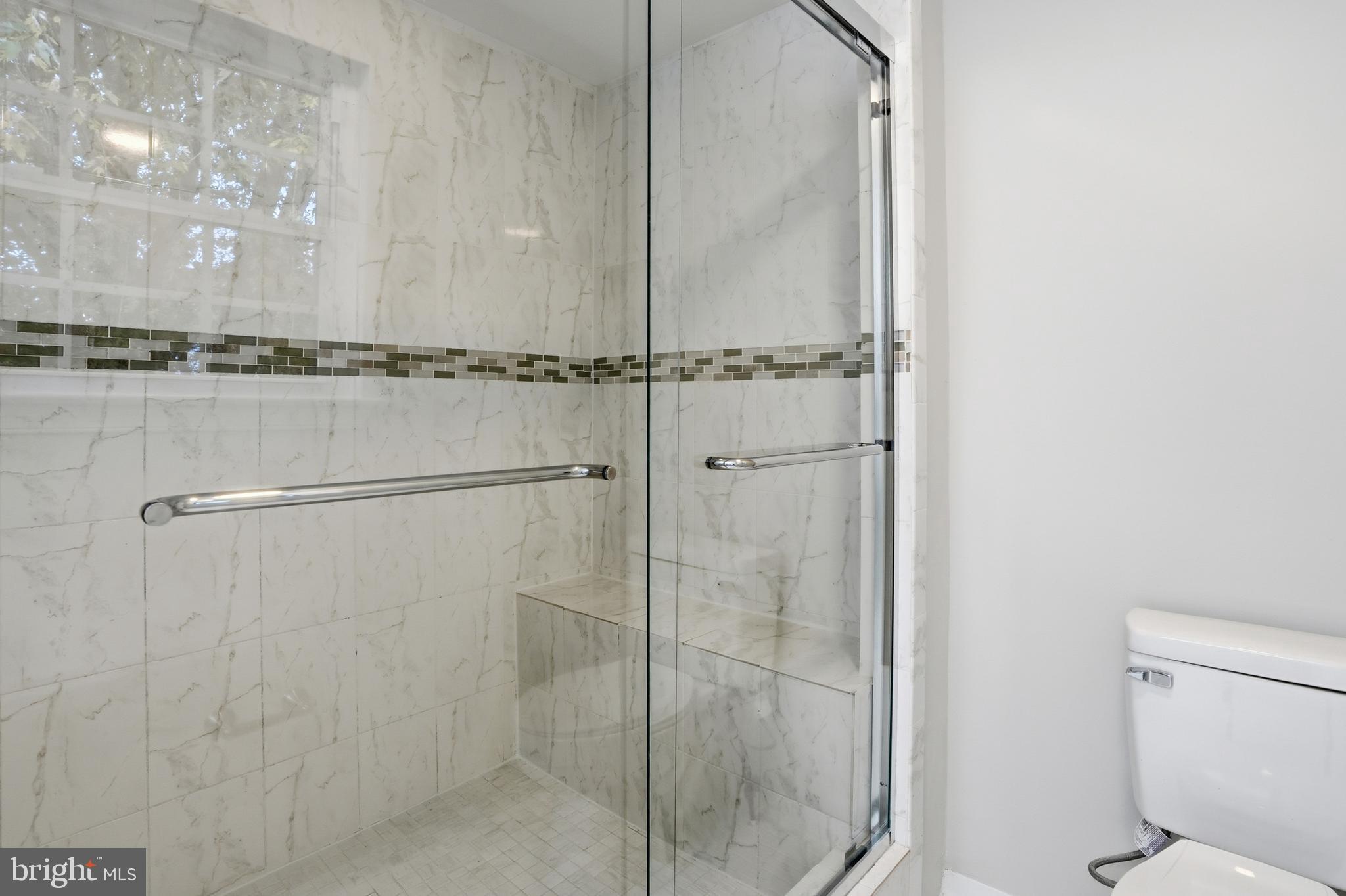 13357 Pelican Road Woodbridge, VA 22193 - Photo 33 of 48 a bathroom with a shower and a toilet
