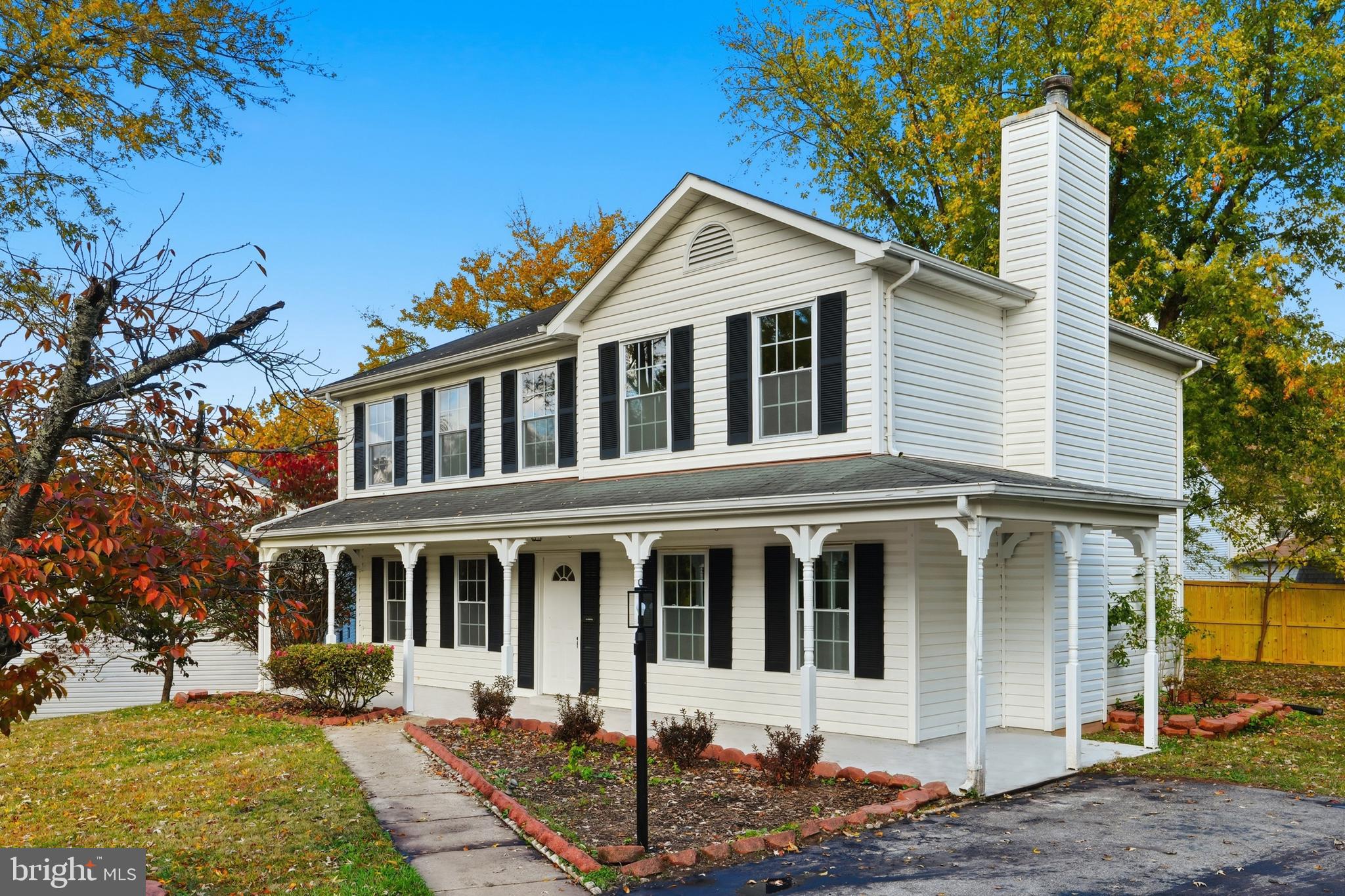 13357 Pelican Road Woodbridge, VA 22193 - Photo 6 of 48 a front view of a house with a yard