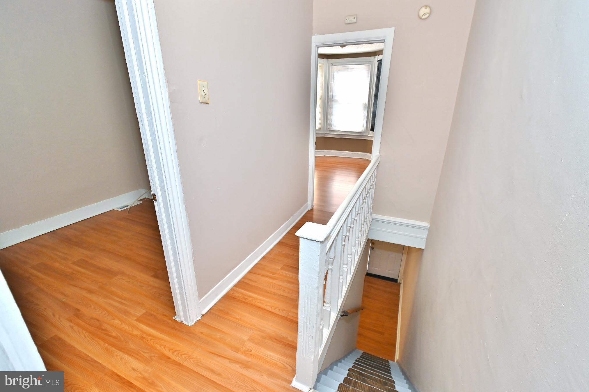 3031 North Lee Street Philadelphia, PA 19134 - Photo 4 of 12 a view of staircase with white walls and railing