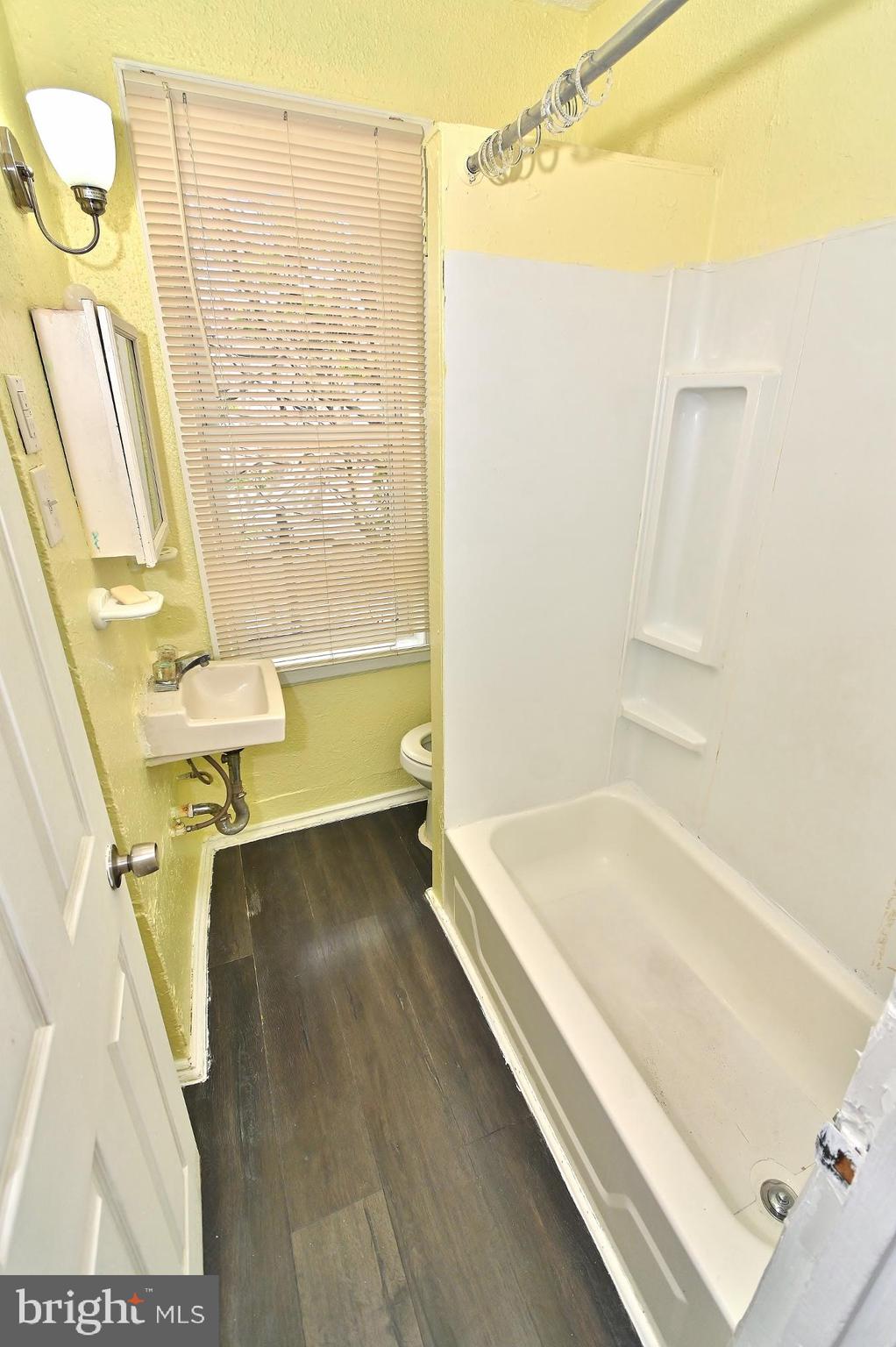 3031 North Lee Street Philadelphia, PA 19134 - Photo 8 of 12 a bathroom with a tub a sink and a shower