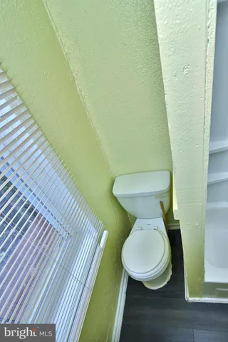 a bathroom with a toilet and a sink