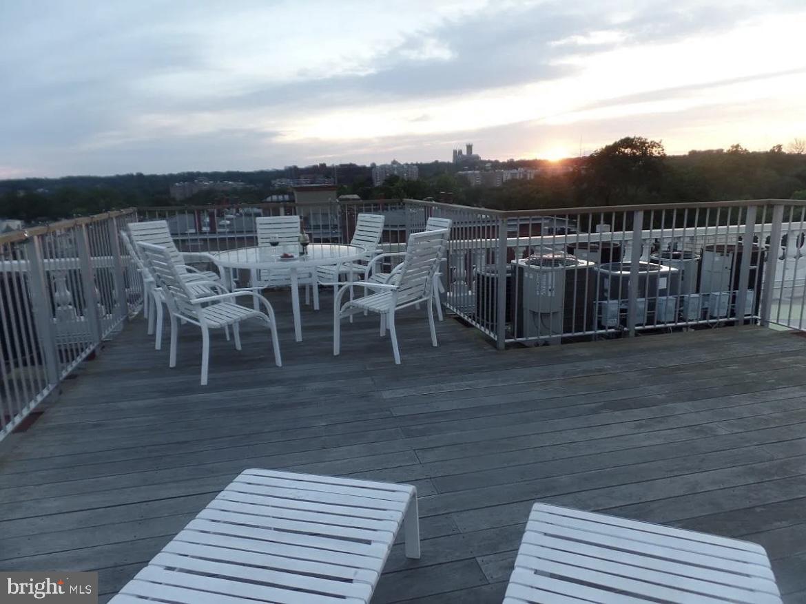 1801 Calvert Street Northwest, Unit G9 Washington, DC 20009 - Photo 17 of 19 a view of a terrace with a table and chairs