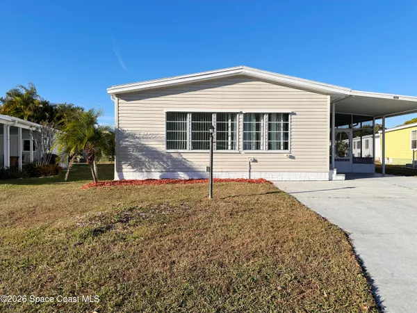 $205,000 | 606 Dolphin Circle, Barefoot Bay, FL 32976