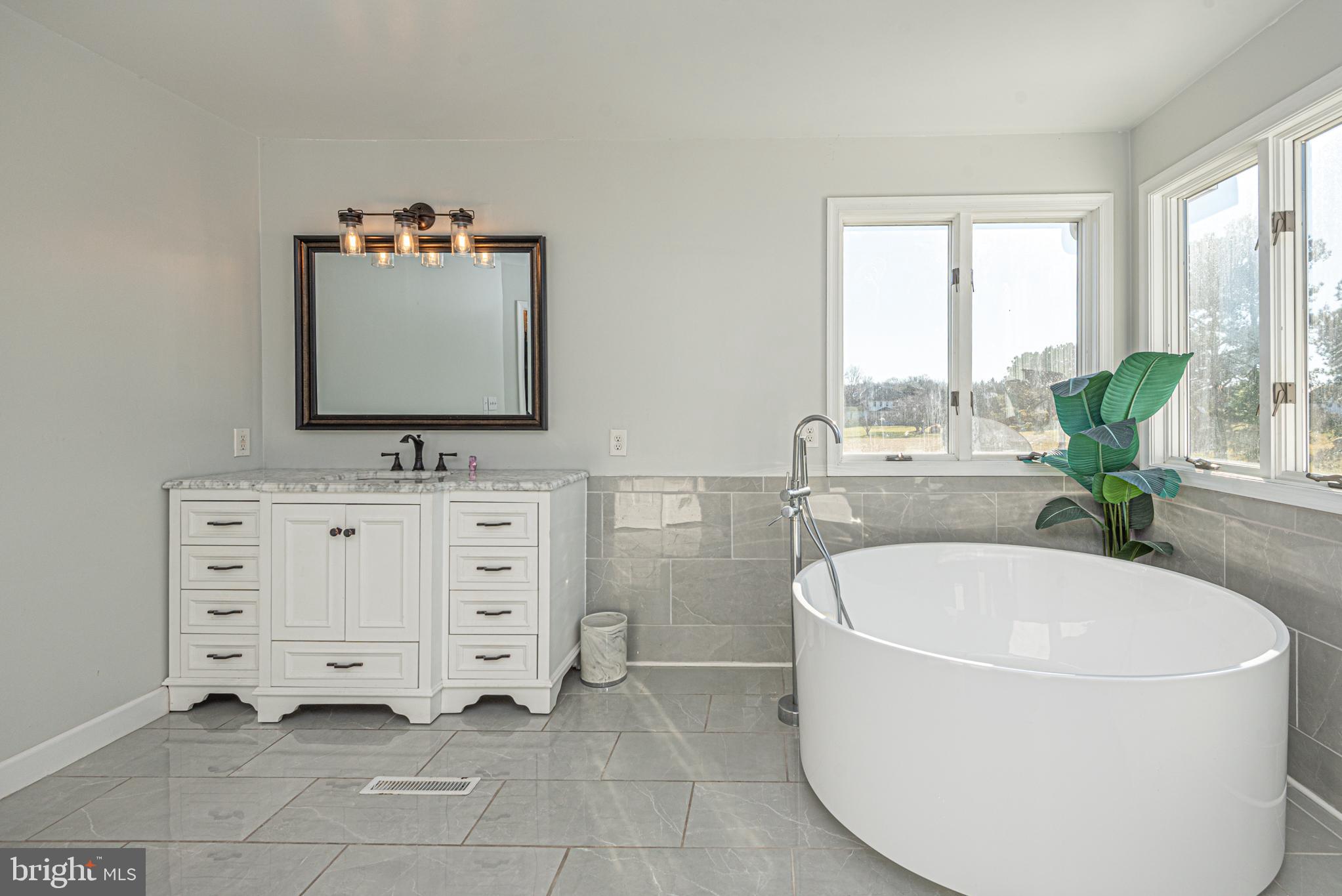10 Ringed Neck Lane Camden Wyoming, DE 19934 - Photo 51 of 78 a bathroom with a tub sink and mirror