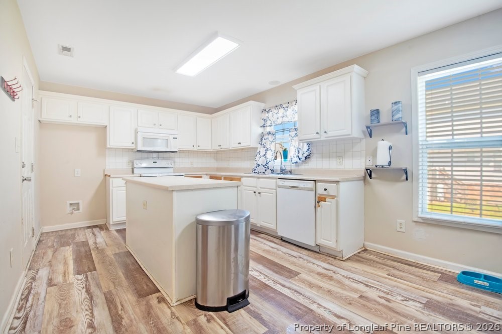 10 Pender Road Spring Lake, NC 28390 - Photo 6 of 35 a kitchen with a sink cabinets and window