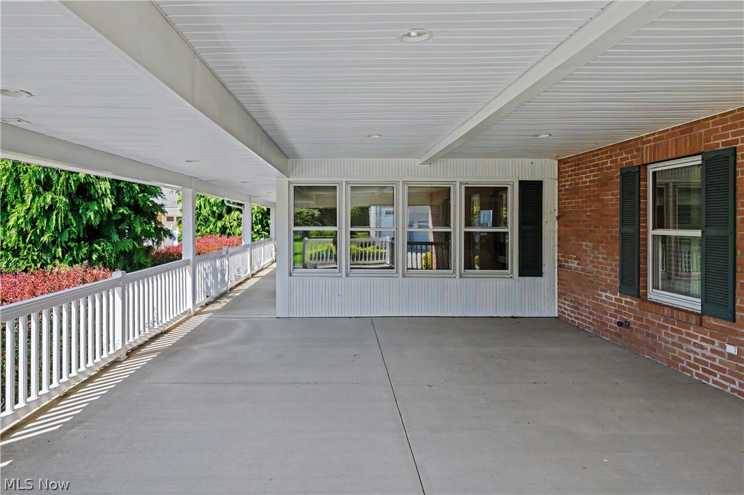 1300 Lake Road Conneaut, OH 44030 - Photo 45 of 45 front porch area with stairs down for walk in access to lower level