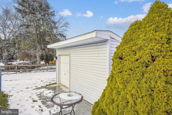 a living room with furniture and entry gate