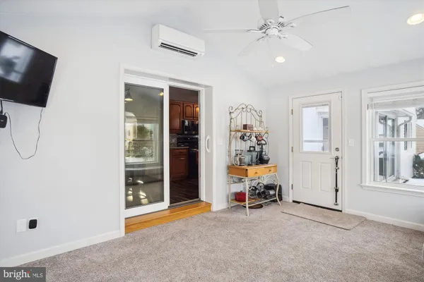 a bedroom with a bed and a large mirror